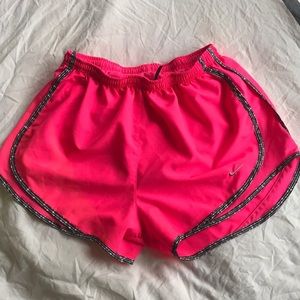 Neon pink Nike running shorts